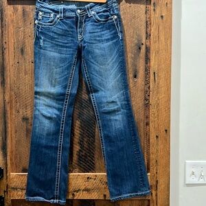 Miss Me Boot Cut Jean with Leather Cross Embellishment